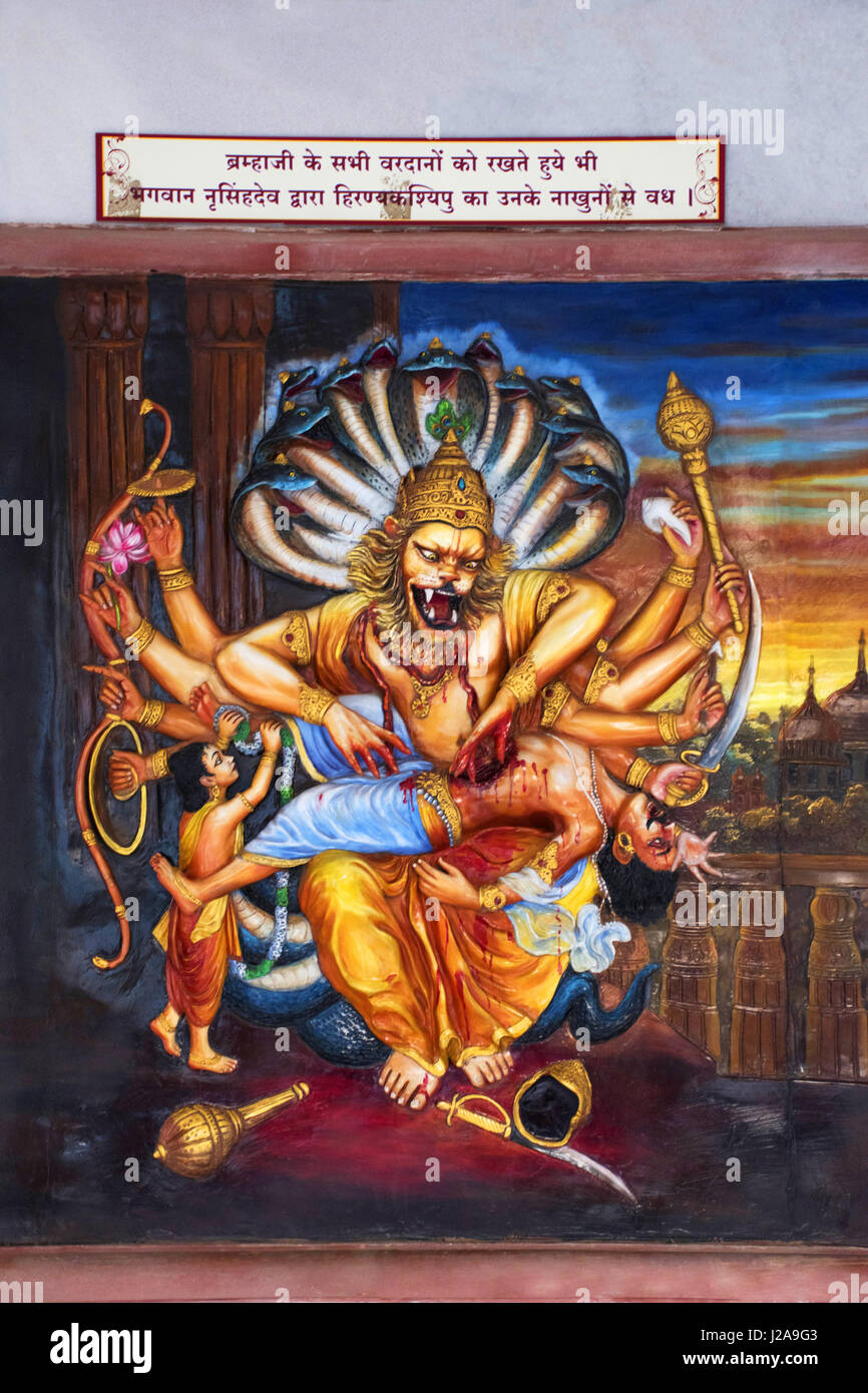 Narasimha Vishnu’s Avatar as semi-man, semi-lion kills the demon Hiranyakashipu with his sharp fingernails. ISKCON temple, Pune, Maharashtra Stock Photo