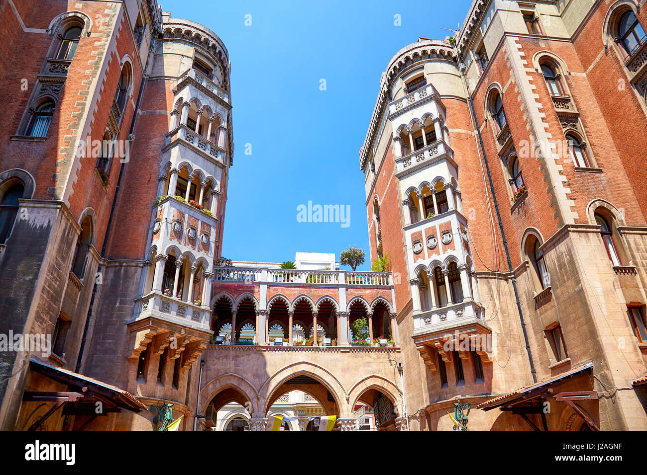 ISTANBUL, TURKEY - JULY 13, 2014:  Two five-storey building and the arch made in Venetian Neo-Gothic style in the courtyard of St. Anthony of Padua Ch Stock Photo