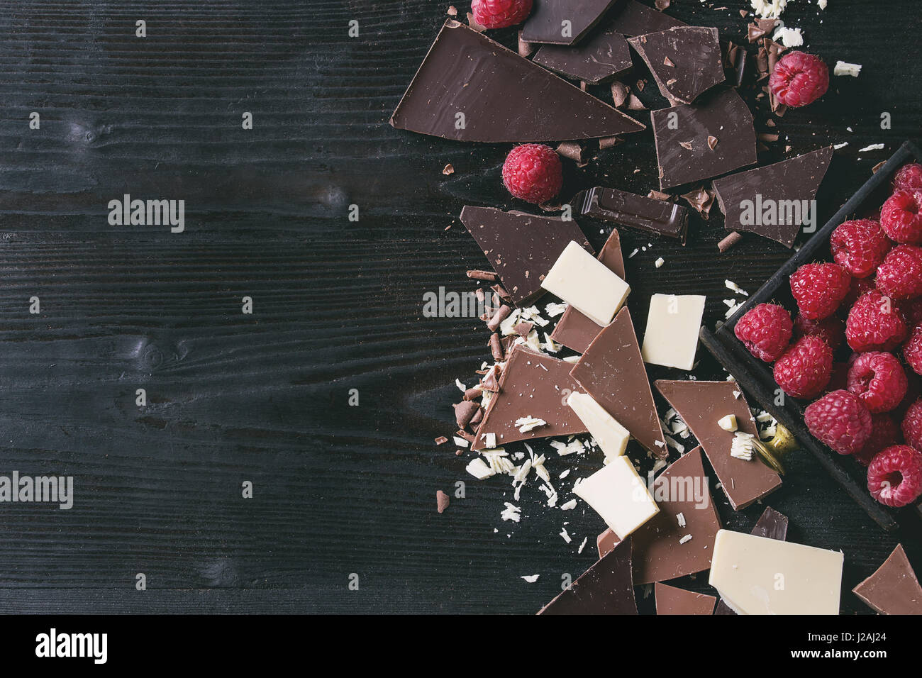 Variety of chopping chocolate with raspberries Stock Photo Alamy
