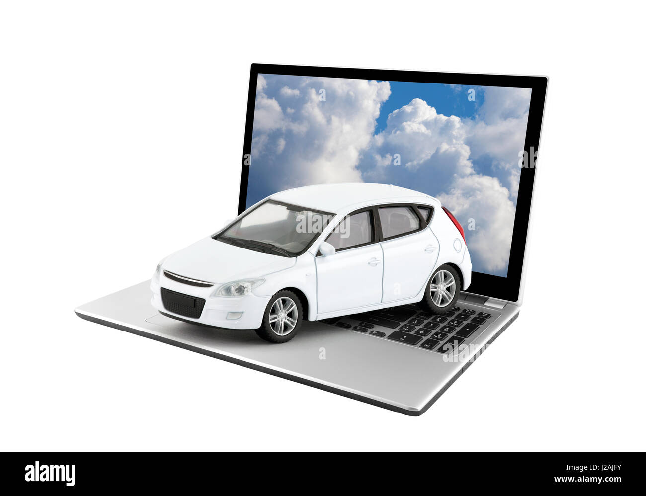 White toy car on laptop isolated on white background Stock Photo