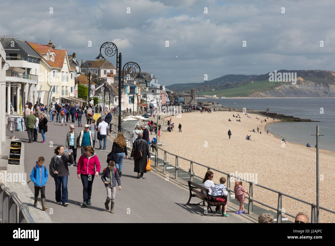 people walking on Marine Parade, Lyme Regis beach, Lyme Regis Dorset England UK Stock Photo