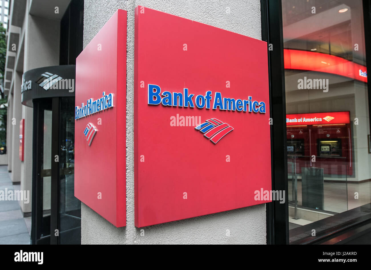 Bank of America logo near the entrance of one of their branches. Stock Photo