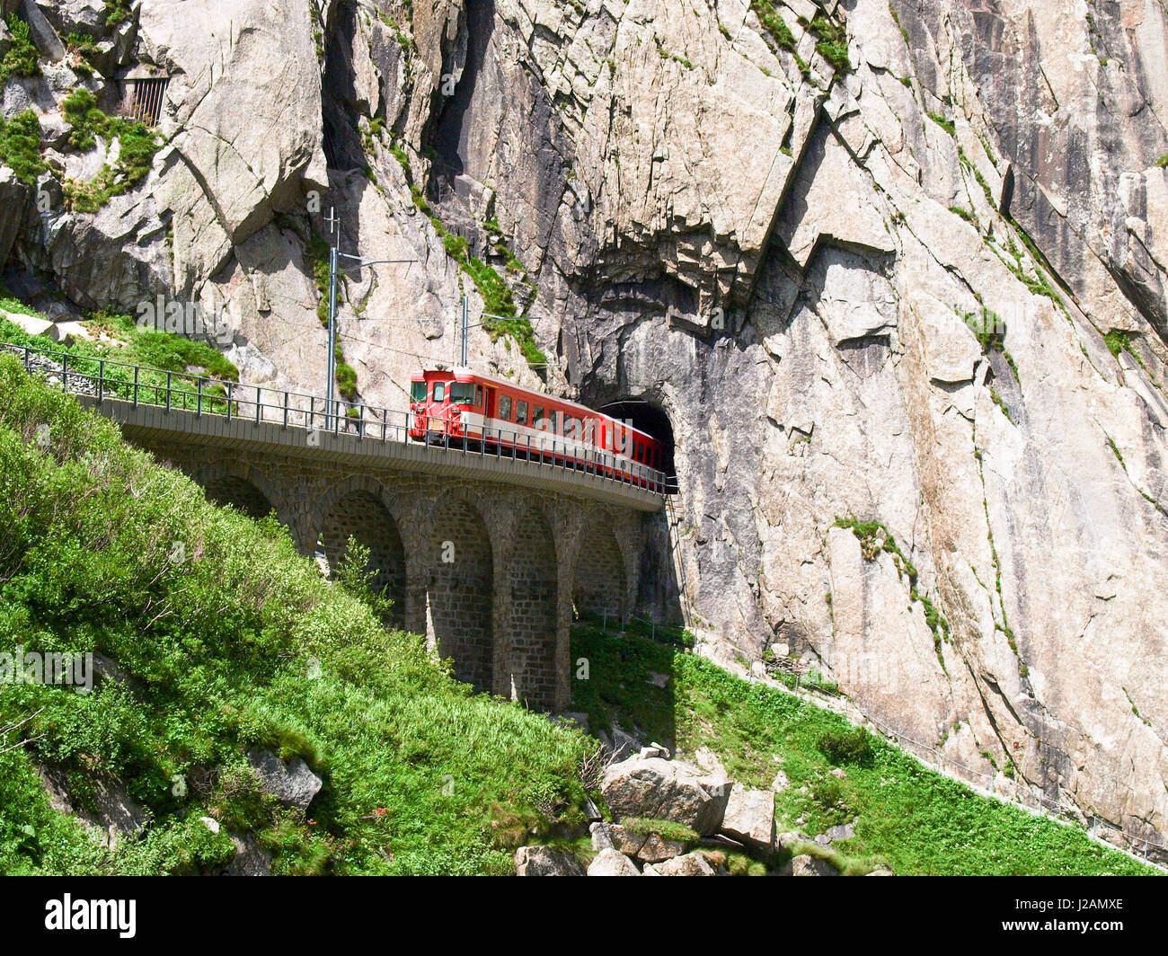 Andermatt, Switzerland - June 28, 2016: Gorge Schöllenen, passage of the train of the Matterhorn-Gotthard Railway. Stock Photo