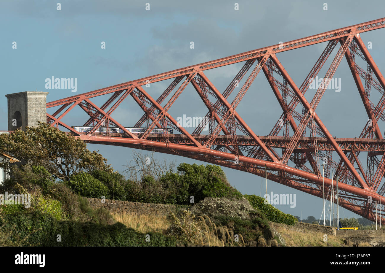 Train enters north end of Forth bridge, Scotland, United Kingdom Stock Photo