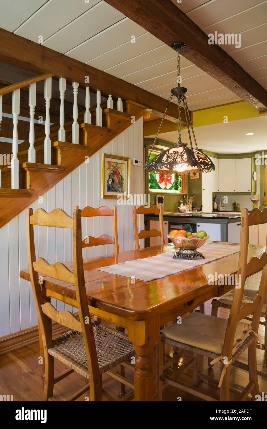 Antique wooden dining table and highback chairs in the dining room