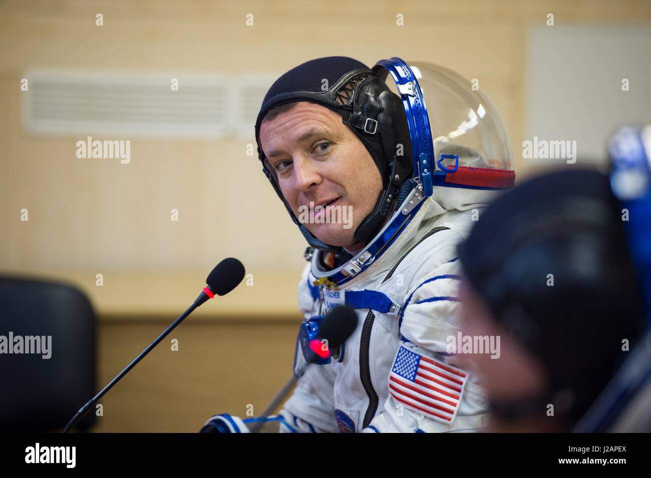 NASA International Space Station Expedition 51 prime crew member American astronaut Jack Fischer speaks with his family after having his Russian Sokol launch and entry spacesuit pressure-checked in preparation for the Soyuz MS-04 launch at the Baikonur Cosmodrome April 20, 2017 in Baikonur, Kazakhstan.     (photo by Aubrey Gemignani /NASA  via Planetpix) Stock Photo