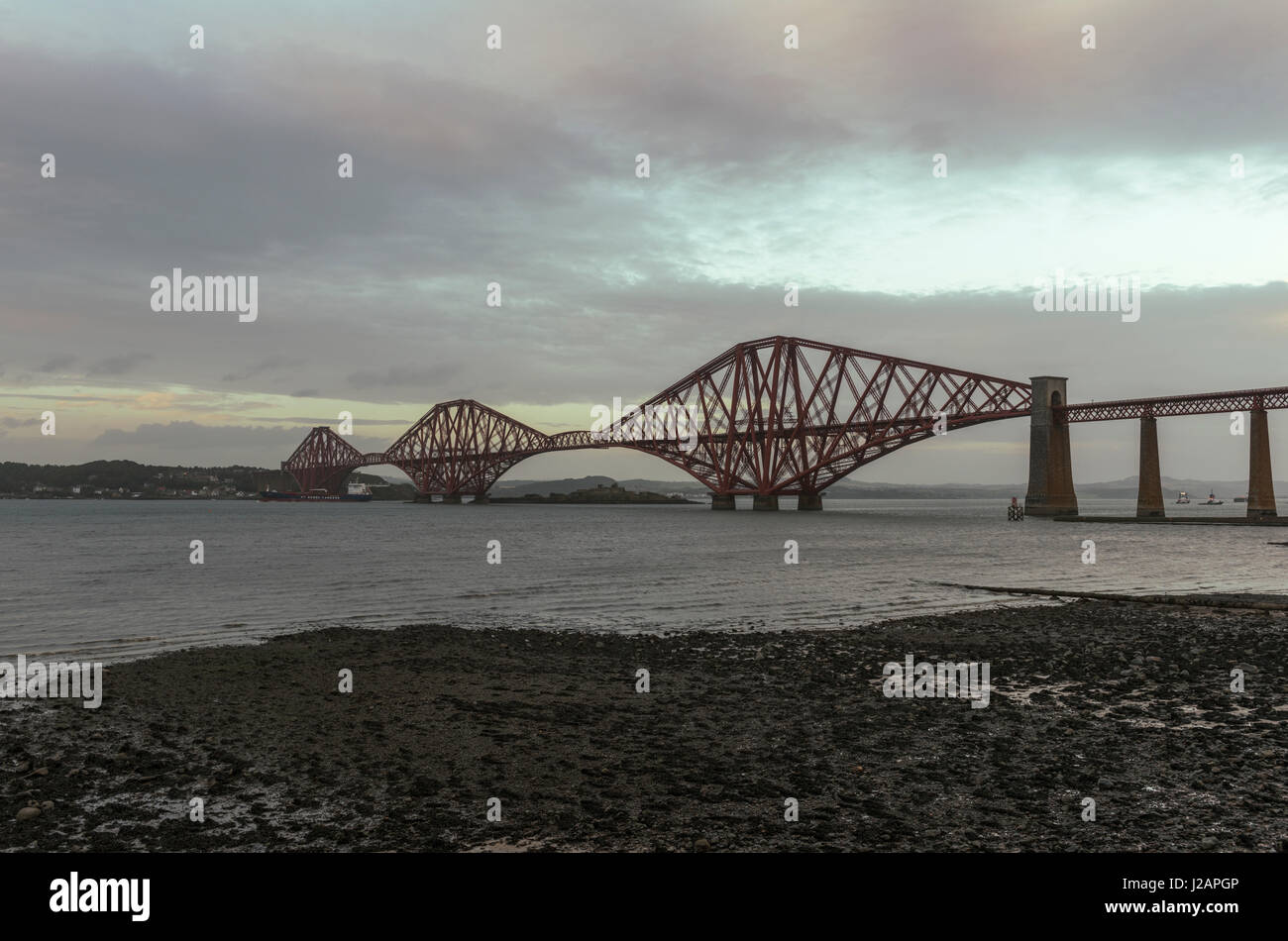 Forth bridge looking north at sunset, South Queensferry, Scotland, United Kingdom Stock Photo