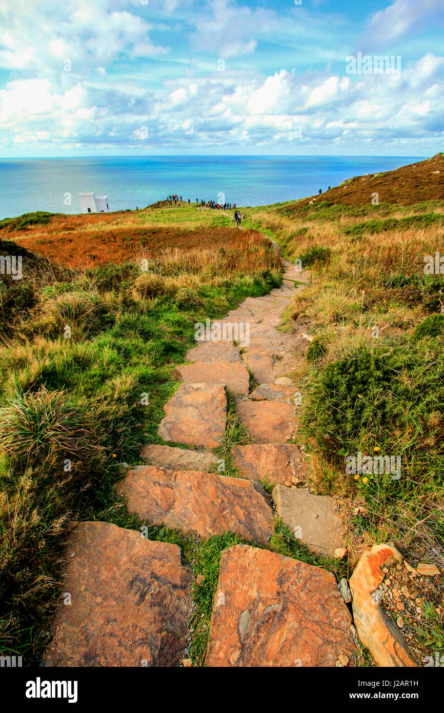 Rock foot path leading to sea and horizon Stock Photo