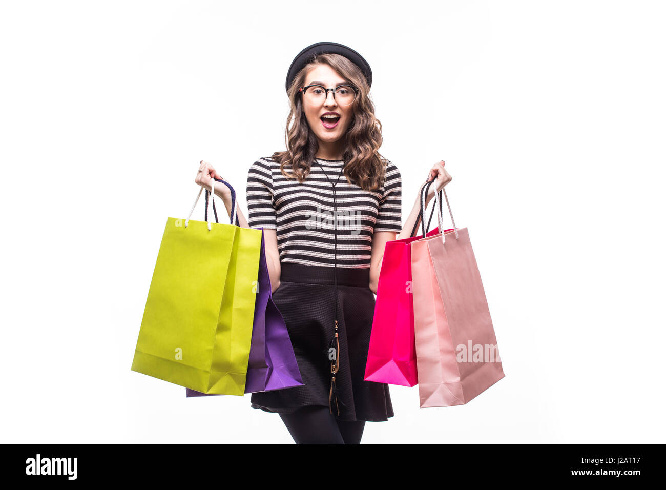 Portrait of young happy smiling woman with shopping bags Stock Photo ...