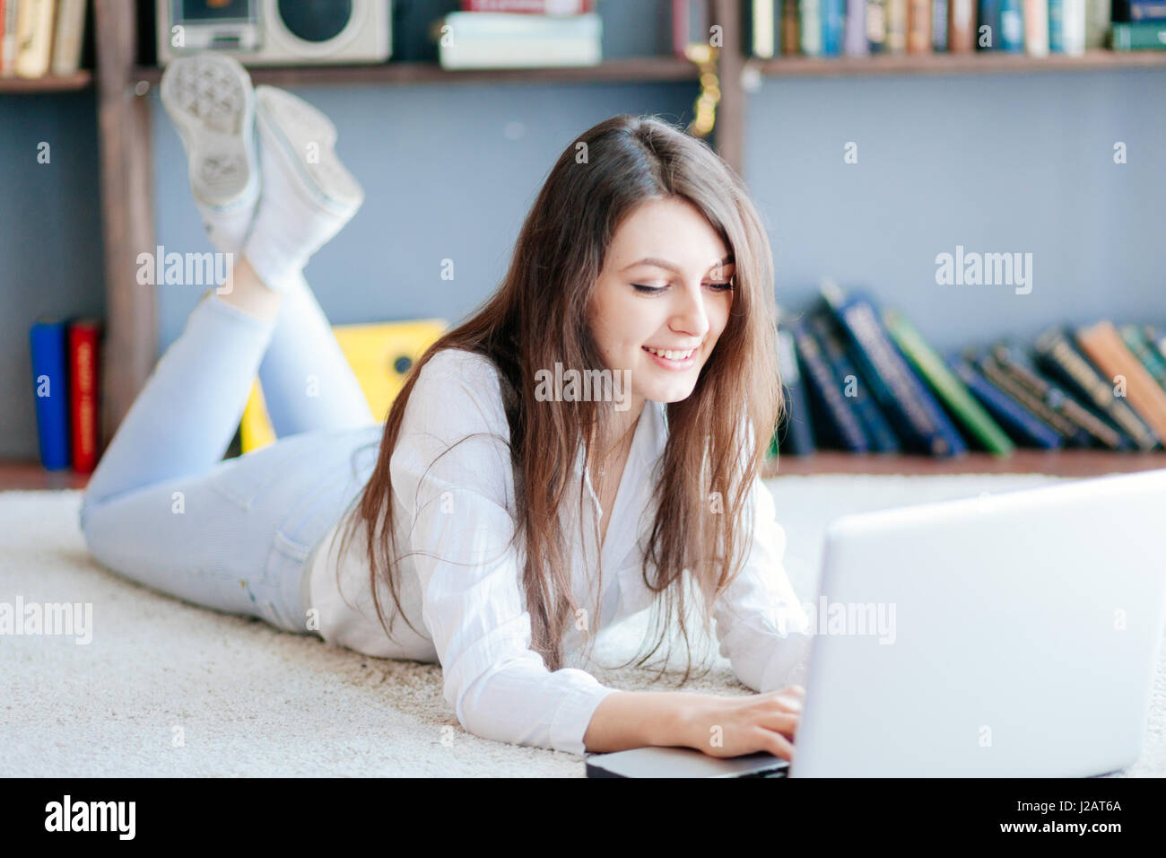 The Young Beautiful Woman Lying on the Floor with Laptop Stock Photo ...