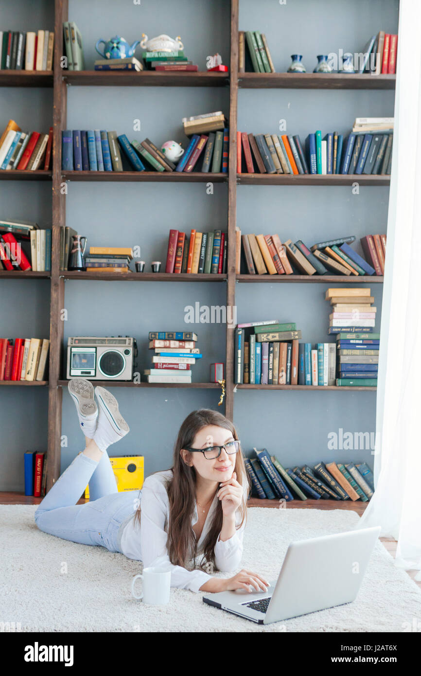The Young Beautiful Woman Lying on the Floor with Laptop Stock Photo ...