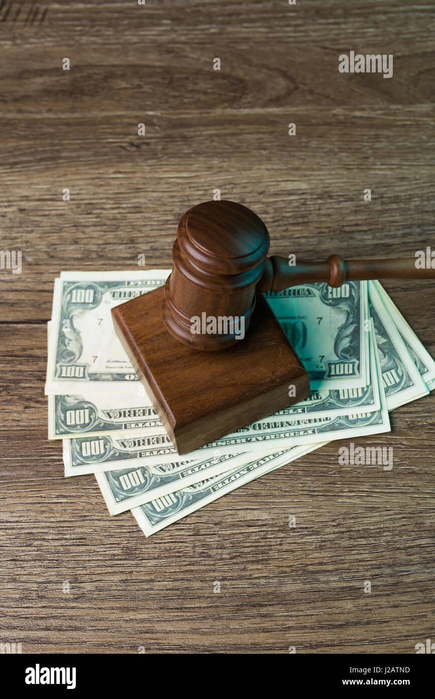 Image of hammer on banknotes Stock Photo