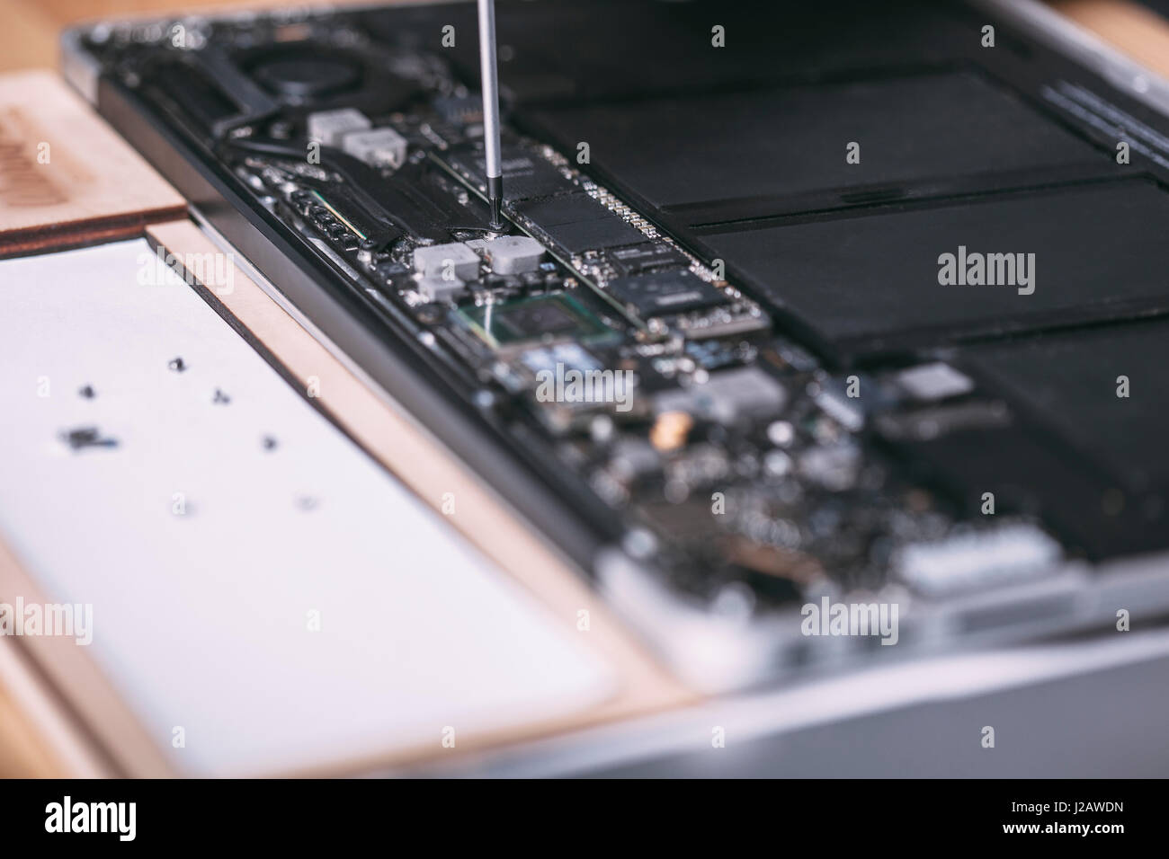 Close-up of digital tablet being repaired at electronics store Stock Photo