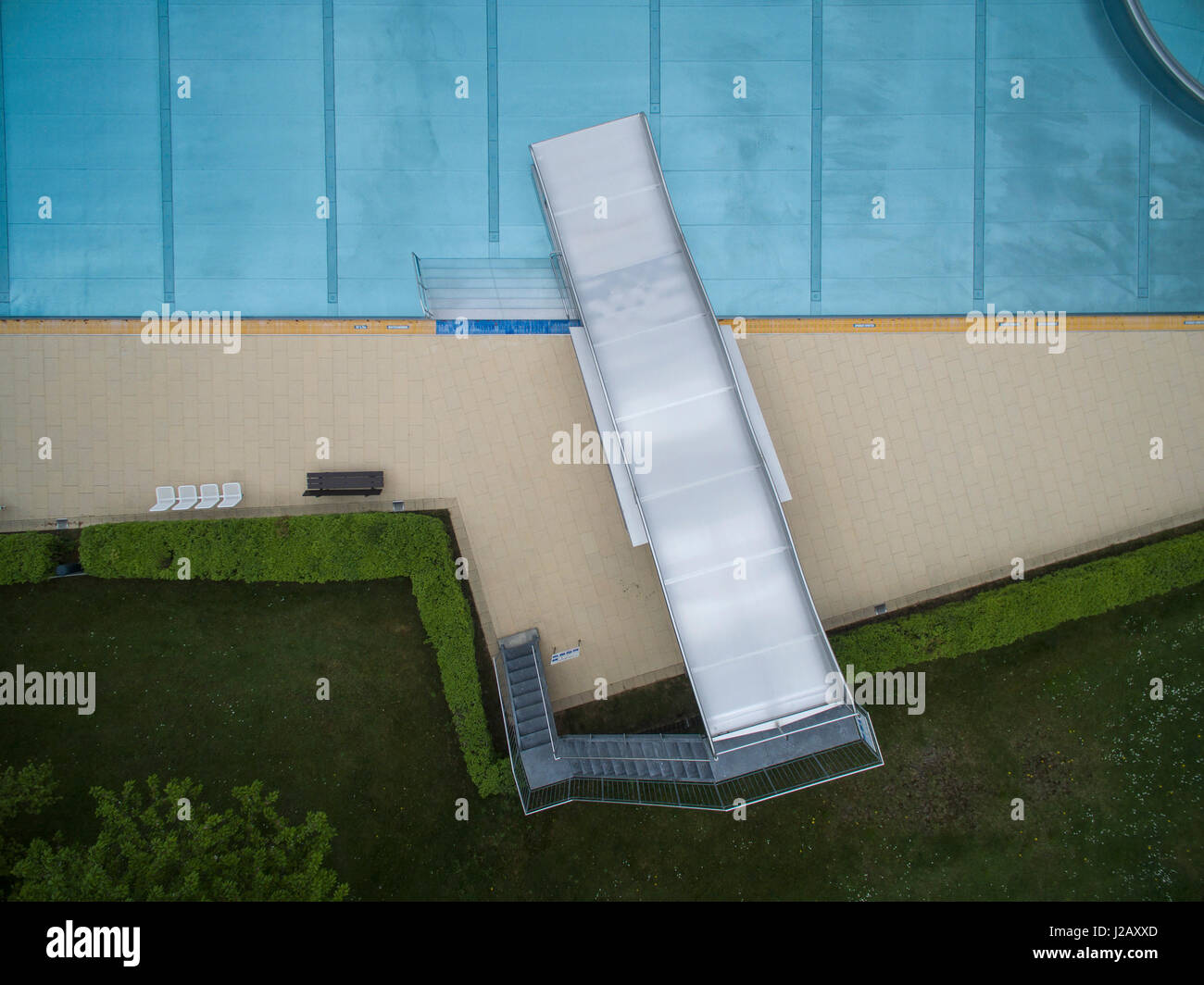Directly above view of metal slide by pool, Sindelfingen, Baden-Wuerttemberg, Germany Stock Photo