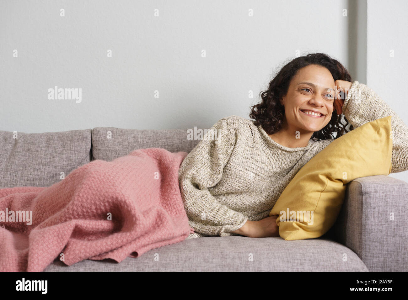 Woman relaxing sofa hi-res stock photography and images - Alamy