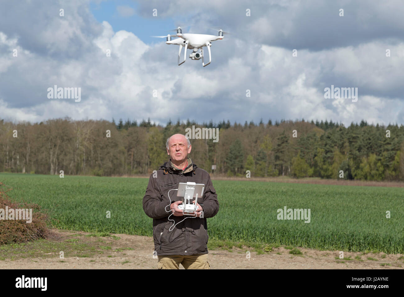 man flying drone Stock Photo