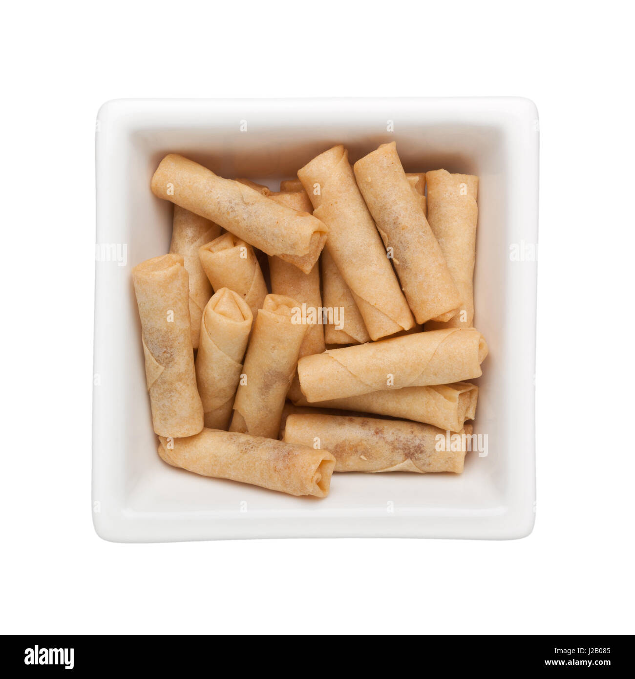 Spicy dried prawn rolls in a square bowl isolated on white background Stock Photo