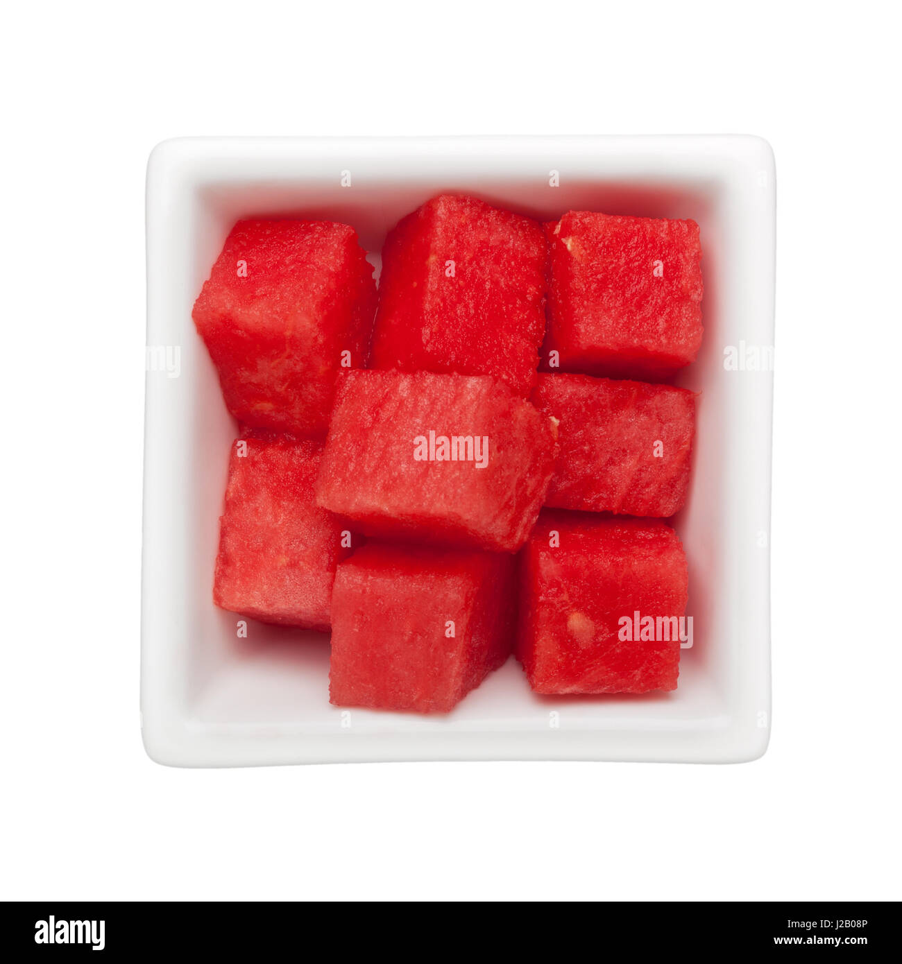 Diced watermelon in a square bowl isolated on white background Stock Photo