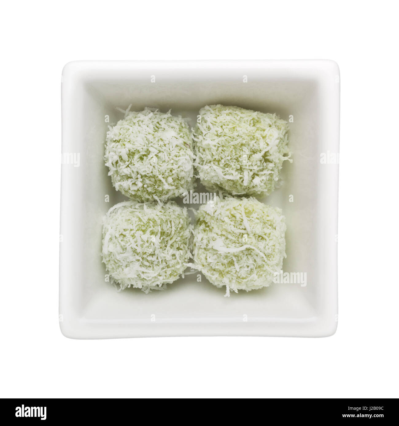 Malay kueh - Ondeh Ondeh in a square bowl isolated on white background Stock Photo
