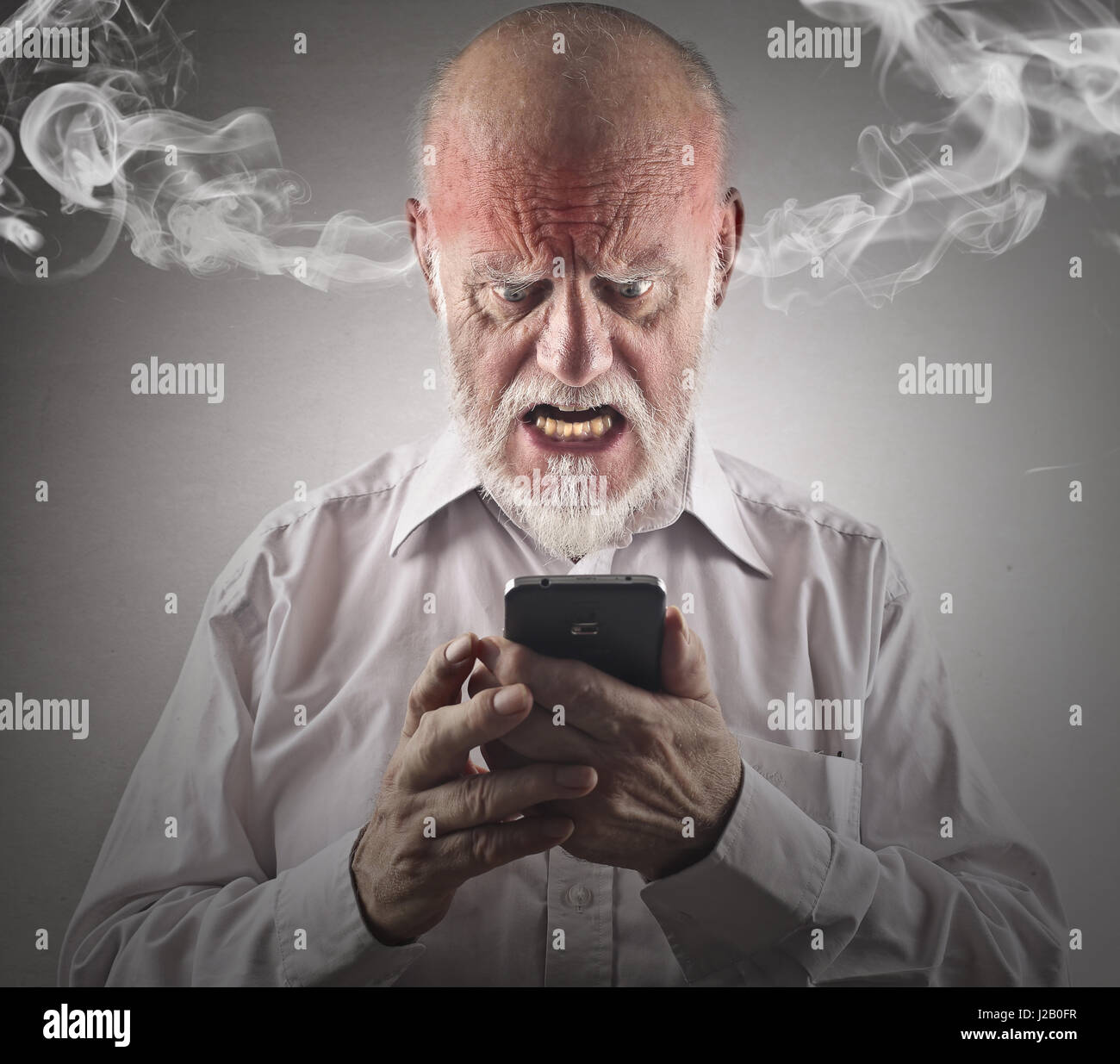 Mad old man, steam coming out of his ears Stock Photo