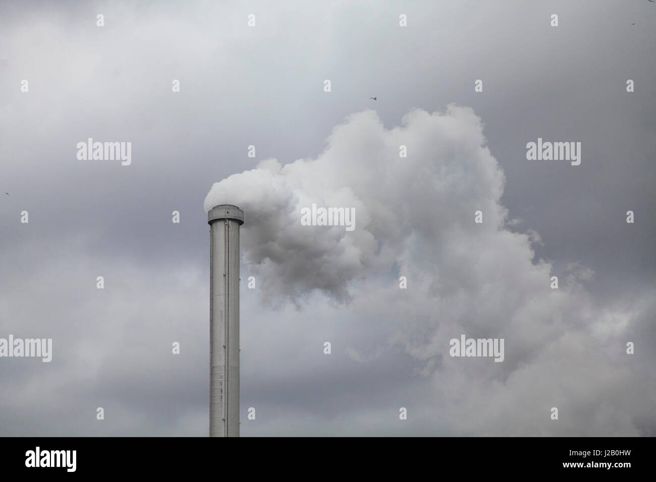 Low angle view of smoke emitting from chimney against cloudy sky Stock ...