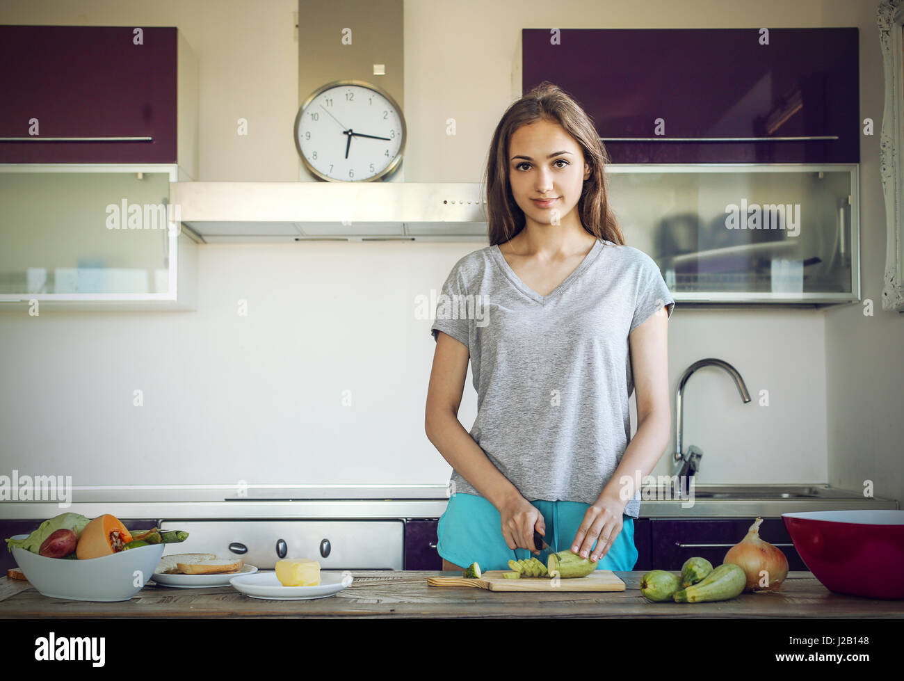 Woman preparing in the kitchen Stock Photo