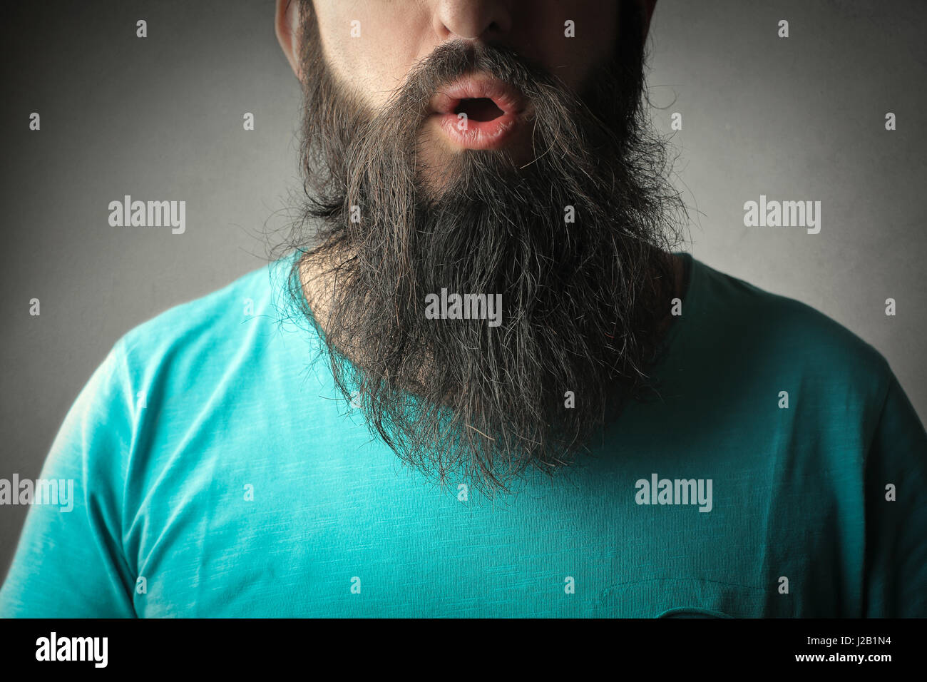 Bearded man with opened mouth Stock Photo