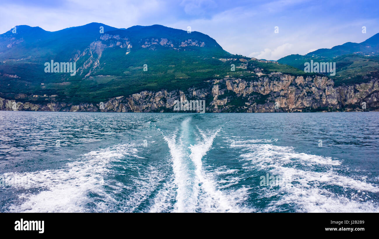 Fishing speedy boat prop wash, white wake on the blue ocean sea Stock Photo  - Alamy