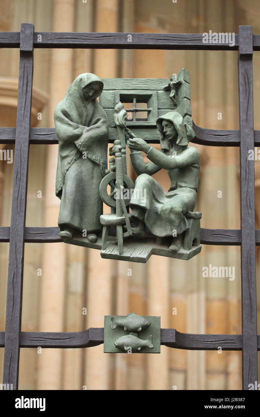 Peasant women spinning in winter. Allegory of seasons designed by Czech sculptor Jaroslav Horejc (1954-1957) for the decorative bronze grille of the Golden Gate of Saint Vitus' Cathedral in Prague, Czech Republic. Stock Photo
