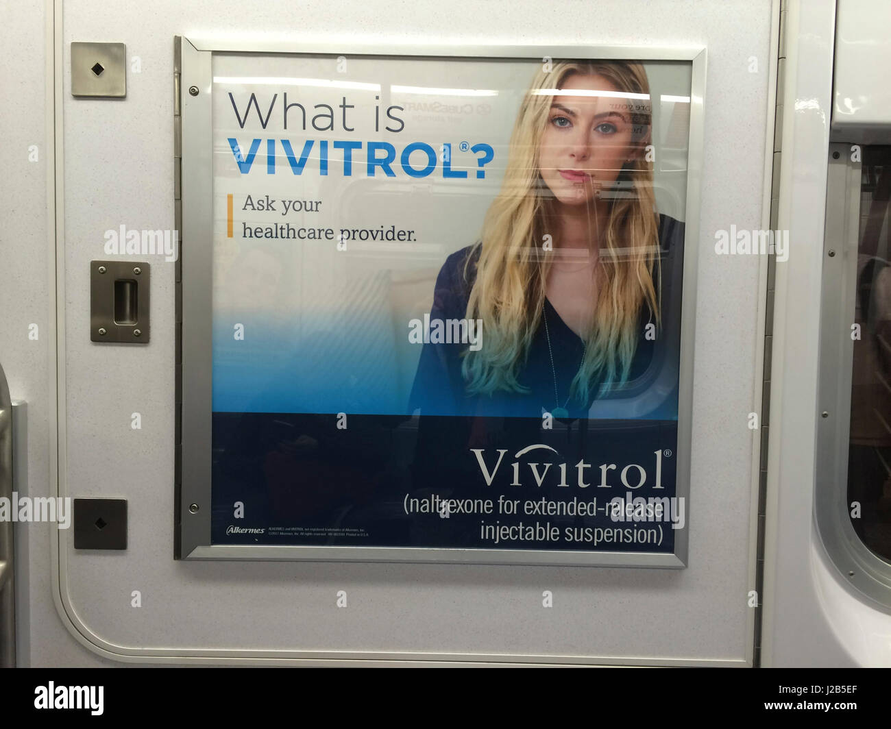 An advertisement for the drug Vivitrol (naltrexone) in a subway car in New York on Friday, April 21, 2017. Vivitrol blocks the effects of narcotic abuse stopping the pain relief and the euphoria associated with being high. The U.S. is encountering an opioid abuse pandemic and Vivitrol is one of the drugs used to combat addiction. (© Frances M. Roberts) Stock Photo