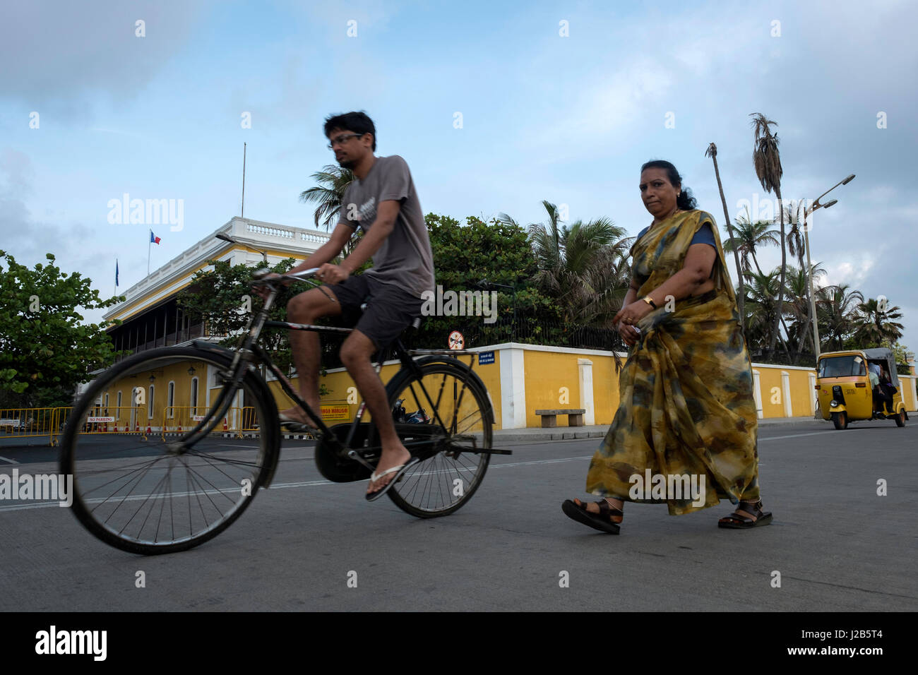 Several people exercise next to the building of the French consulate. Stock Photo