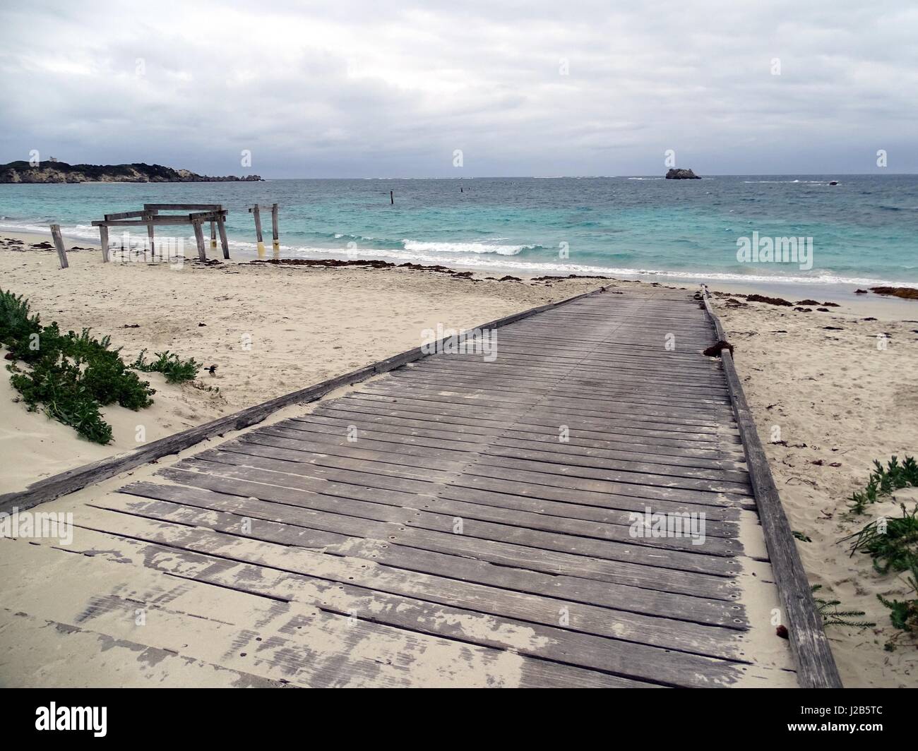 A wooden boat ramp on a beach in Western Australia Stock Photo
