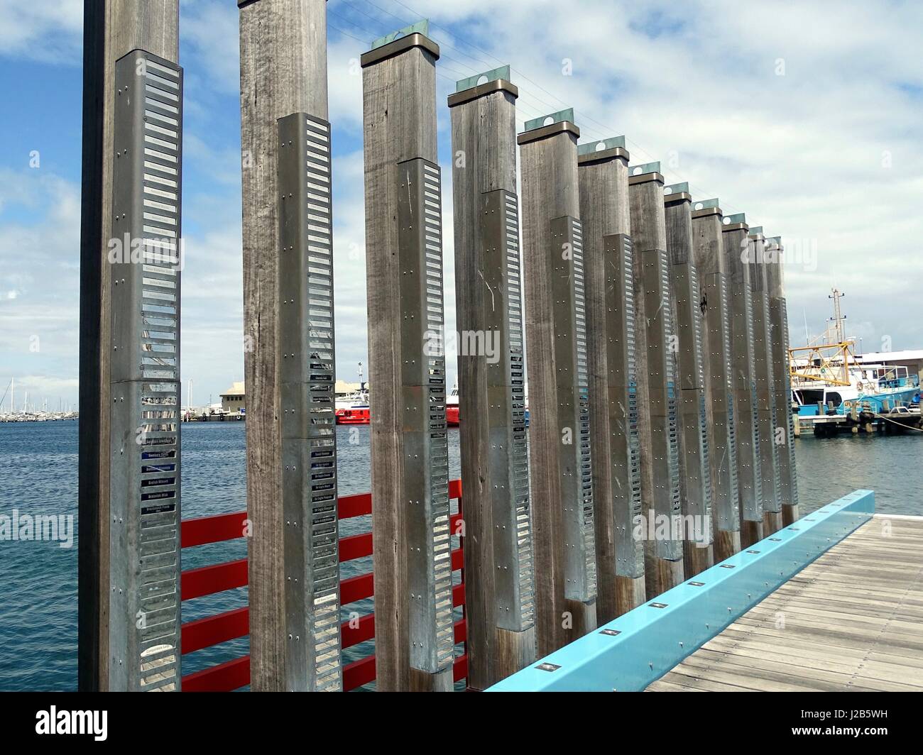 A series of timber posts commemorating local fisherman Stock Photo