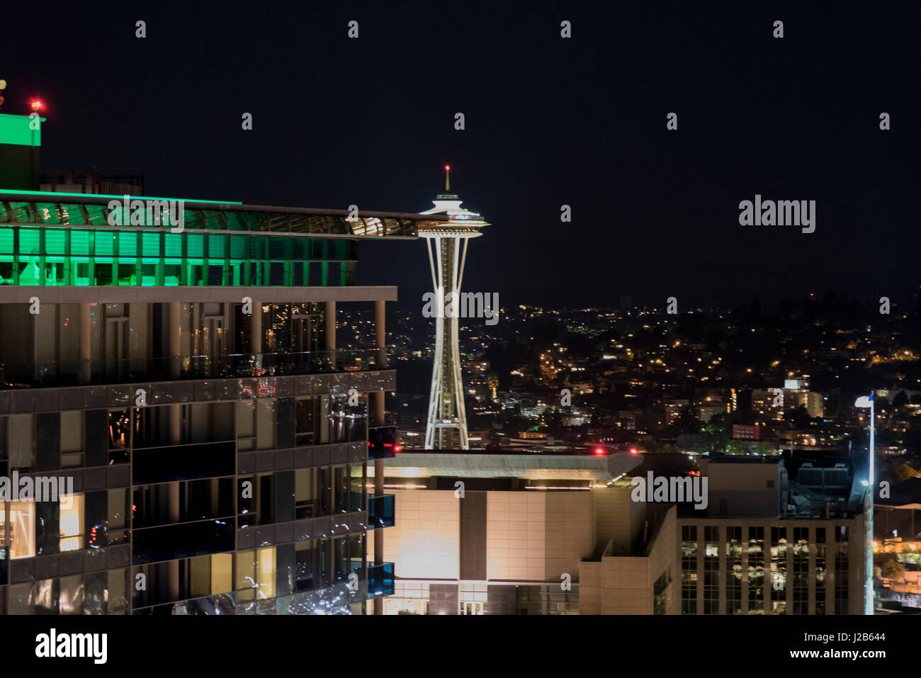 Night view of Seattle space needle from downtown high rise Stock Photo