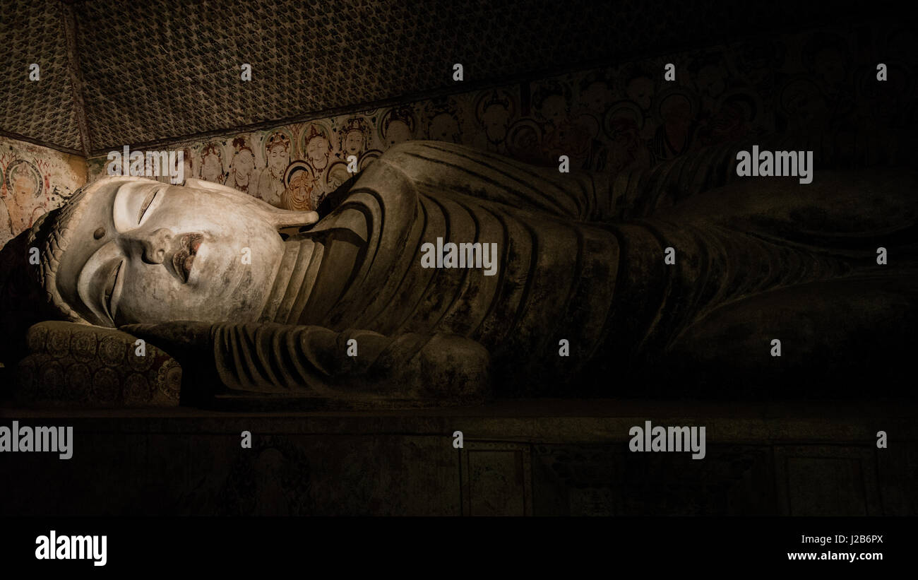 Replica of Dunhuang Reclining Buddha Sculpture Stock Photo