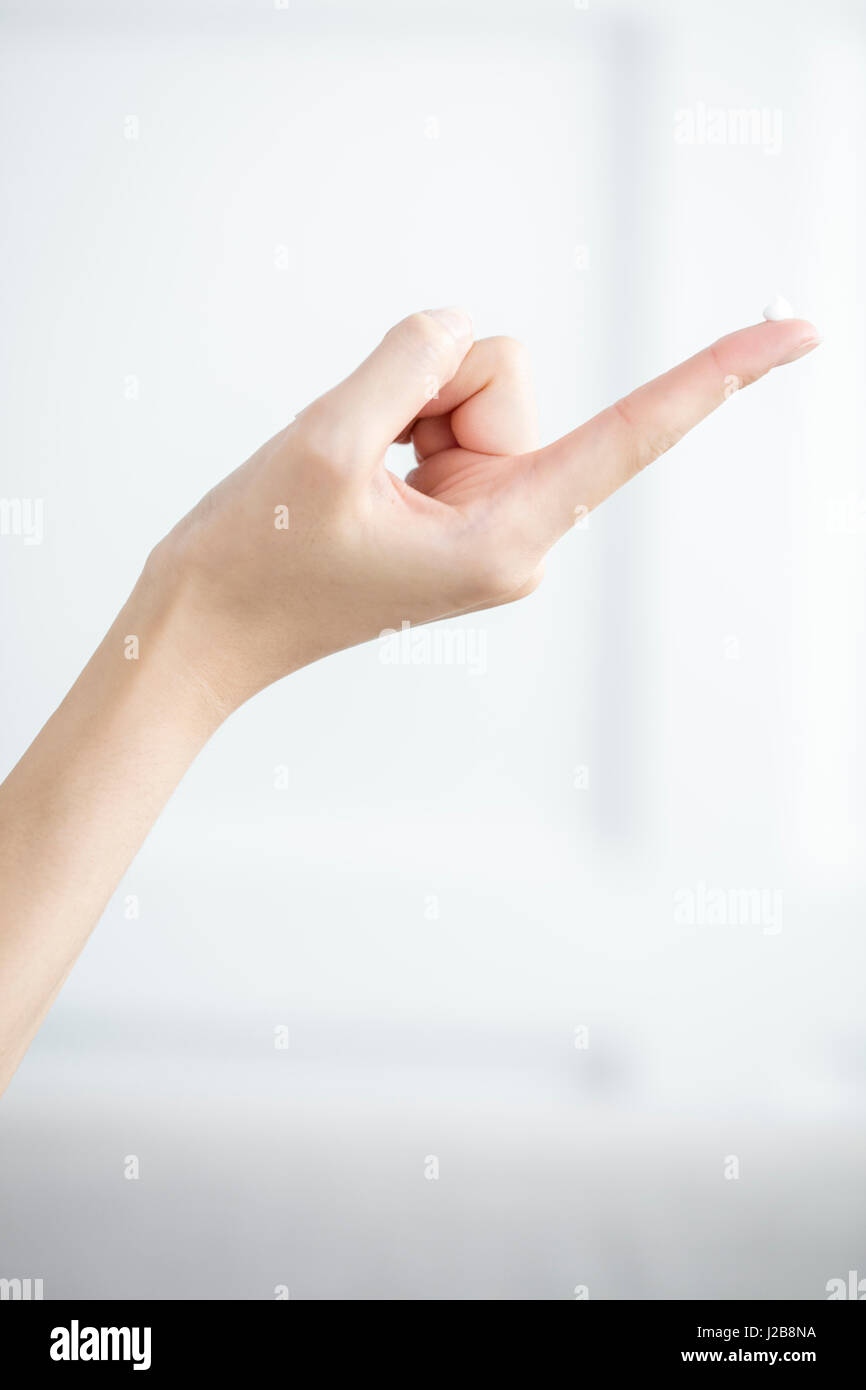 Hand with cream on fingertip Stock Photo Alamy