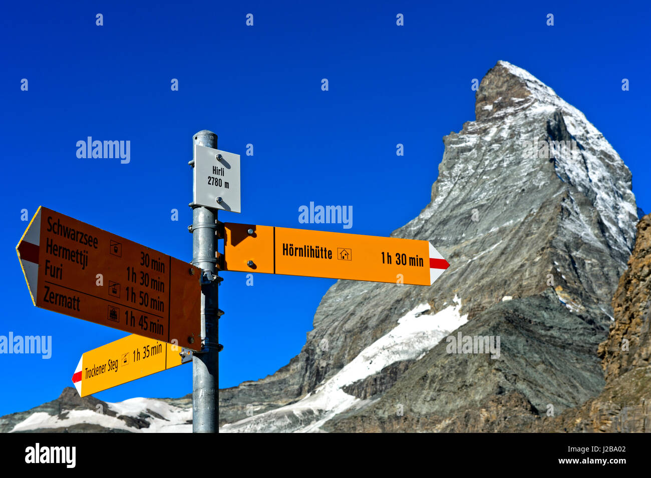 Directional sign to the Hörnli refuge at Hirli in front of the Matterhorn peak, Zermatt, Valais, Switzerland Stock Photo