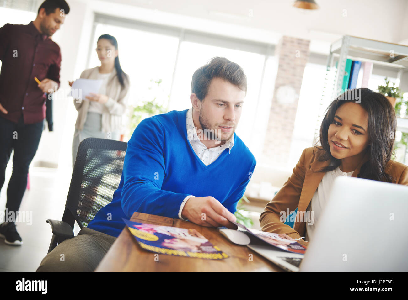 Young business people at place of work Stock Photo