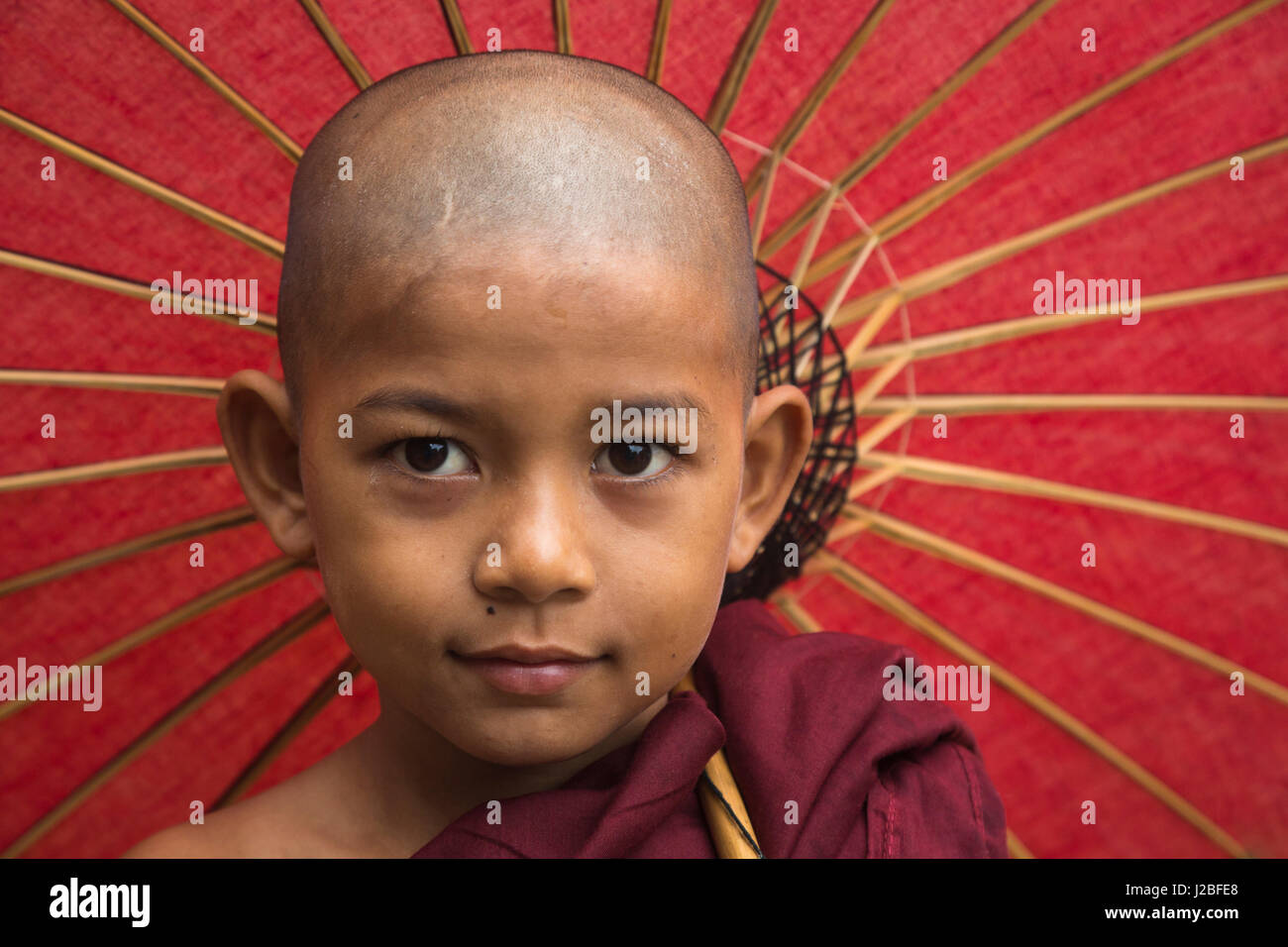 Myanmar. Portrait of a young monk with umbrella Stock Photo Alamy