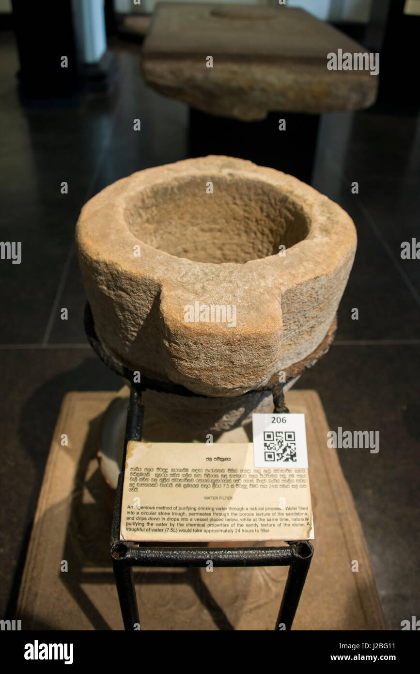 Sri Lanka, Colombo, National Museum aka Sri Lanka National Museum. Ancient natural stone water filter. For editorial use only. Stock Photo