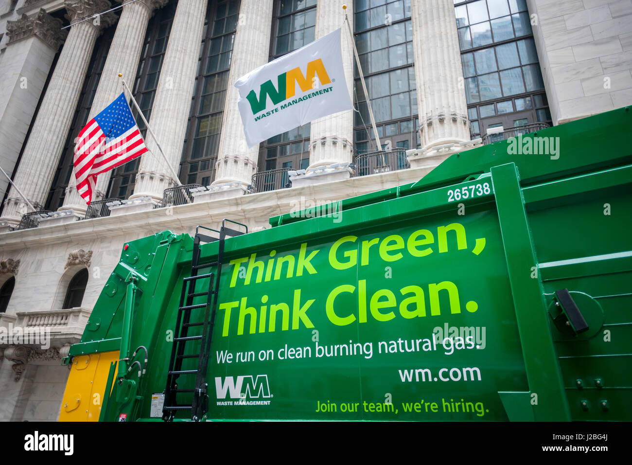 Waste Management (WM) vehicles are parked in front of the New York Stock Exchange on Friday, April 21, 2017 as WM  rings the closing bell in celebration of Earth Day. (© Richard B. Levine) Stock Photo