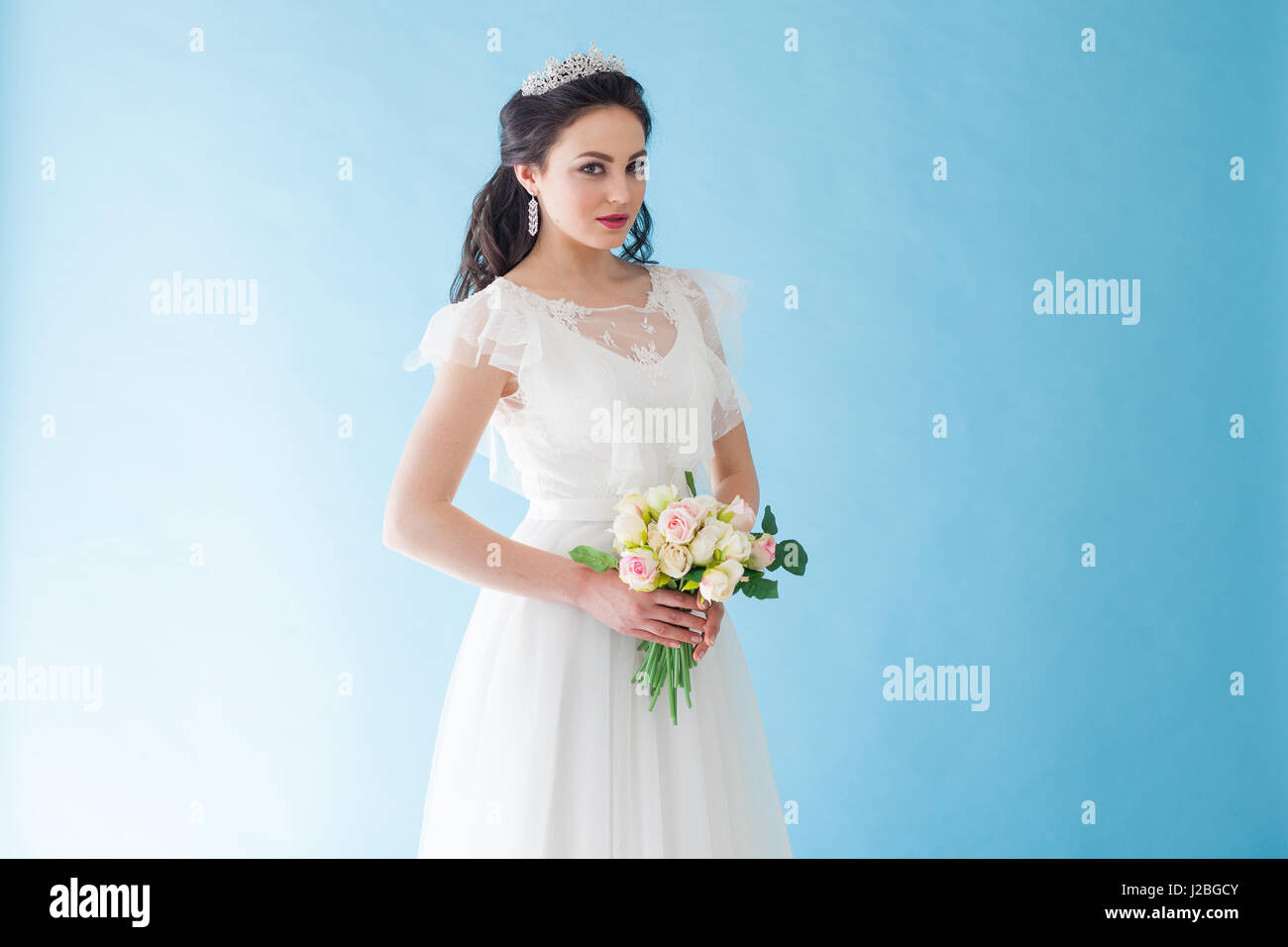 Princess Bride in a white dress with a Crown on a blue background Stock ...