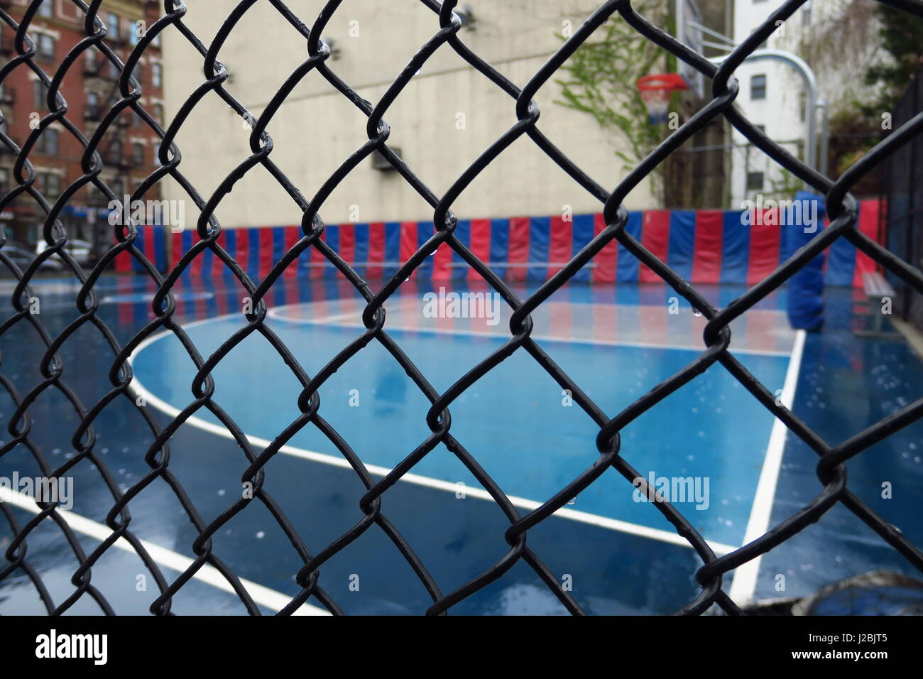 Basketball court in rain Stock Photo Alamy