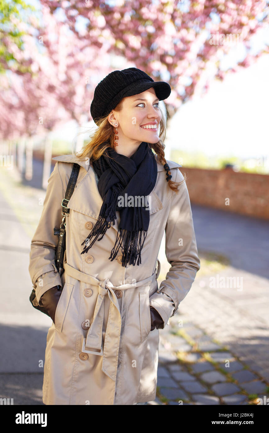 Young life balanced woman waliking in park at spring, looks away Stock Photo