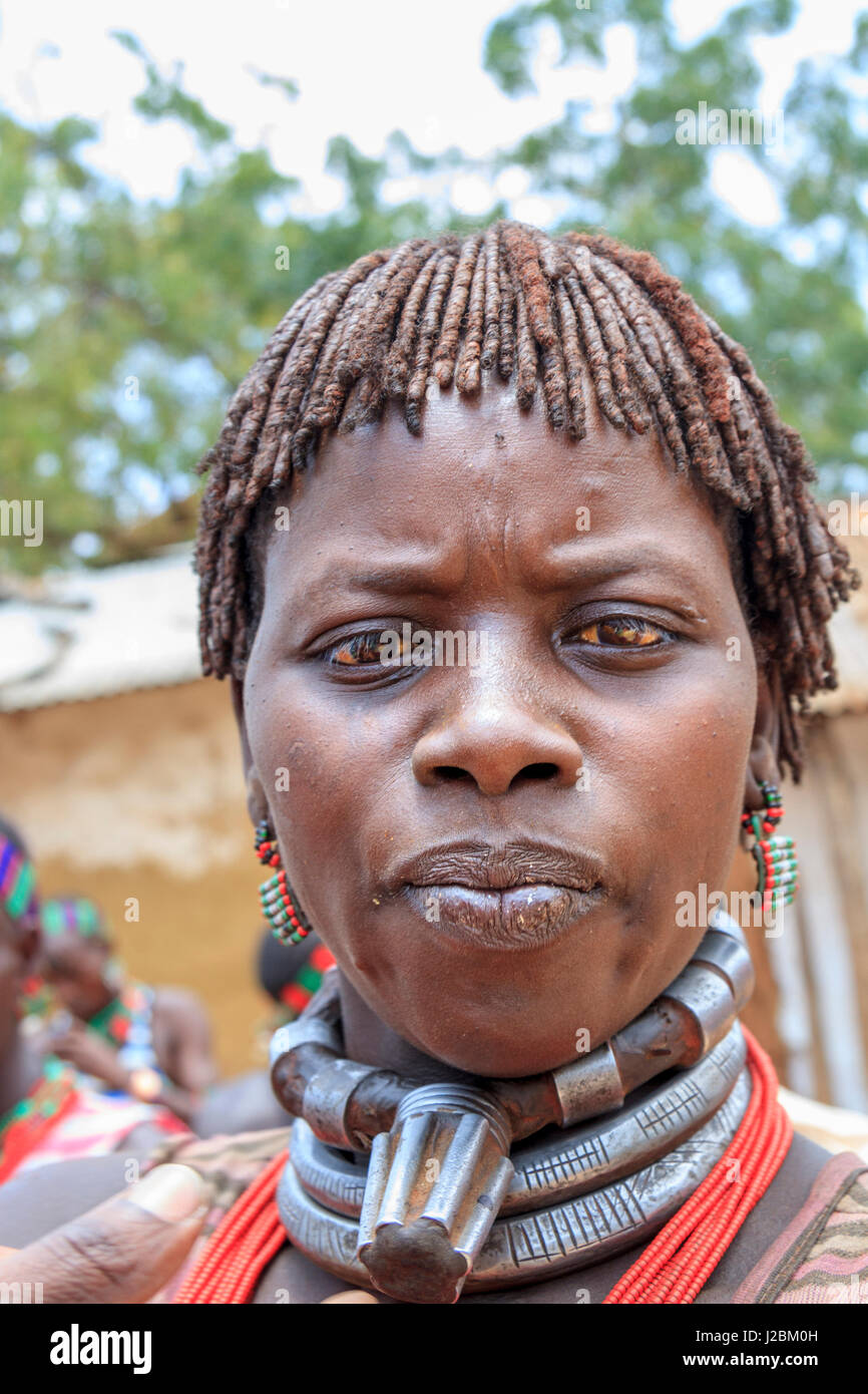 Hamer woman with typical thick plates of ochre colored hair. Dileka. Ethiopia, Africa. Stock Photo