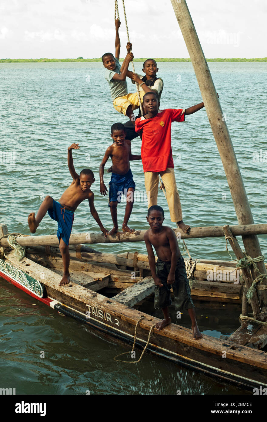 Kenya, Lamu archipelago, Lamu, children having fun on sinking pirate boat Stock Photo