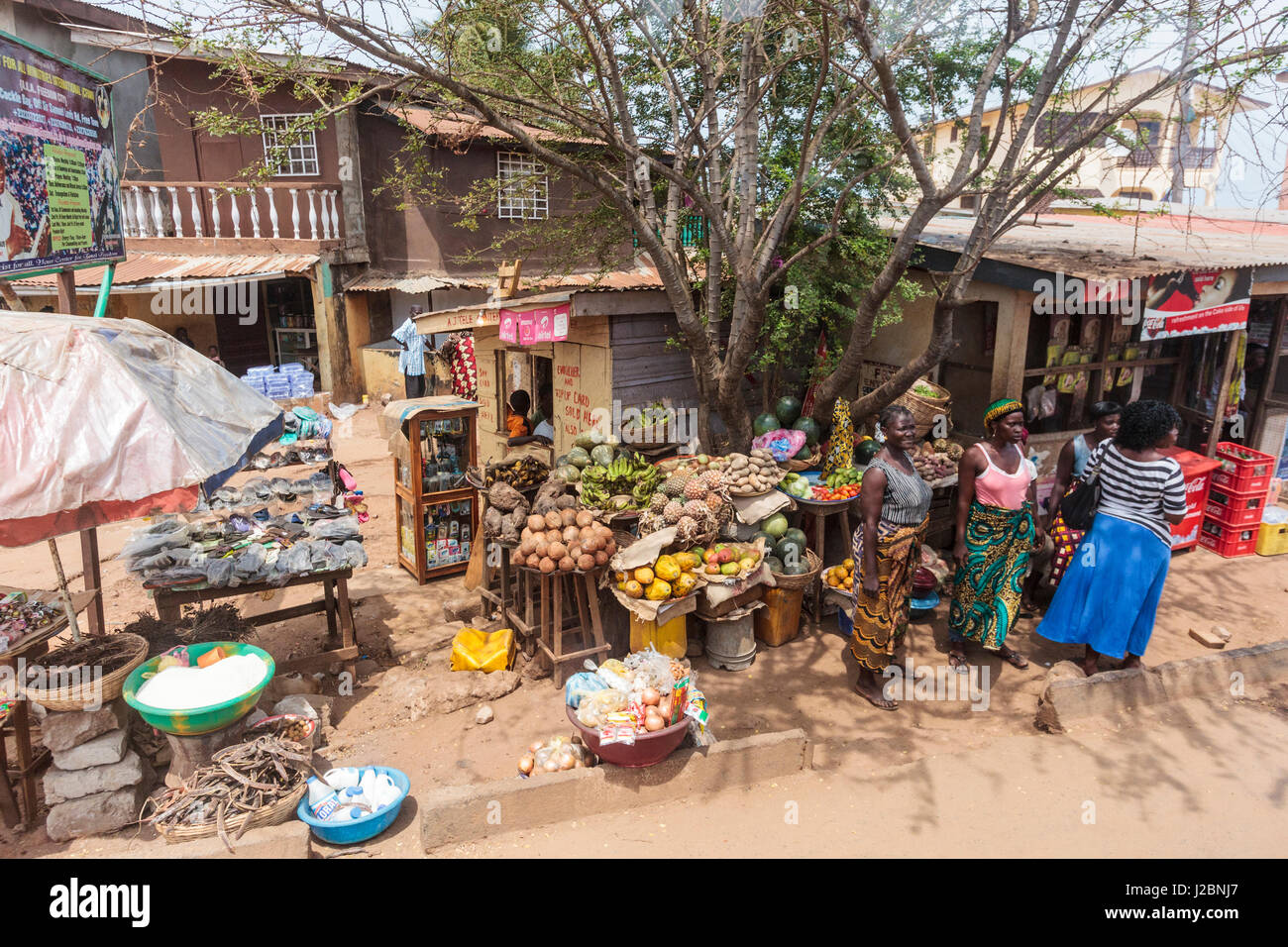 Africa, Sierra Leone, Freetown. Women standing in front of a food Stock