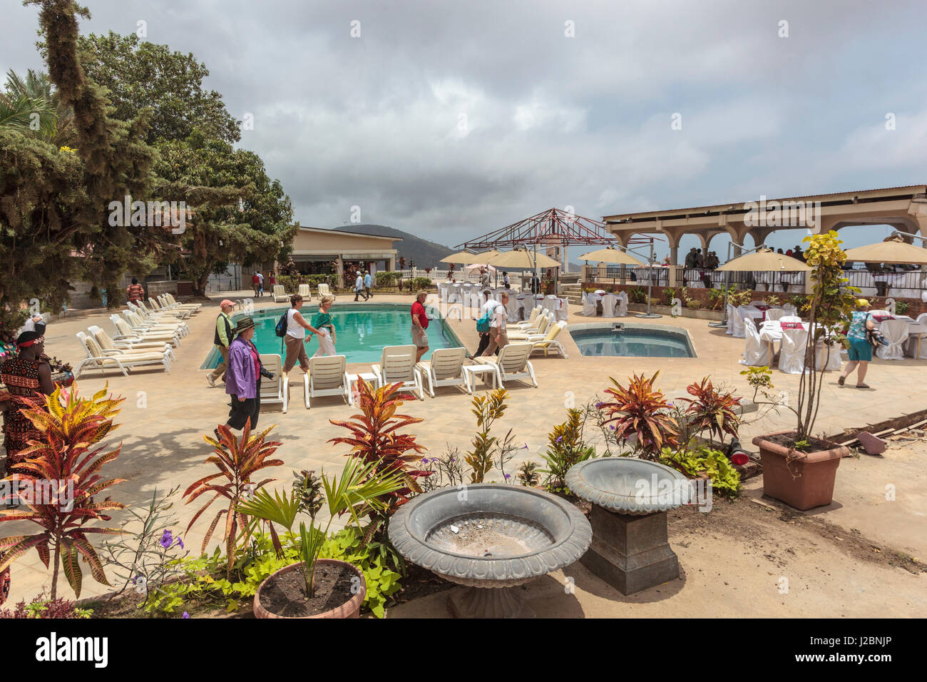 Africa, Sierra Leone, Freetown. Tourists at a hotel pool and patio. Stock Photo