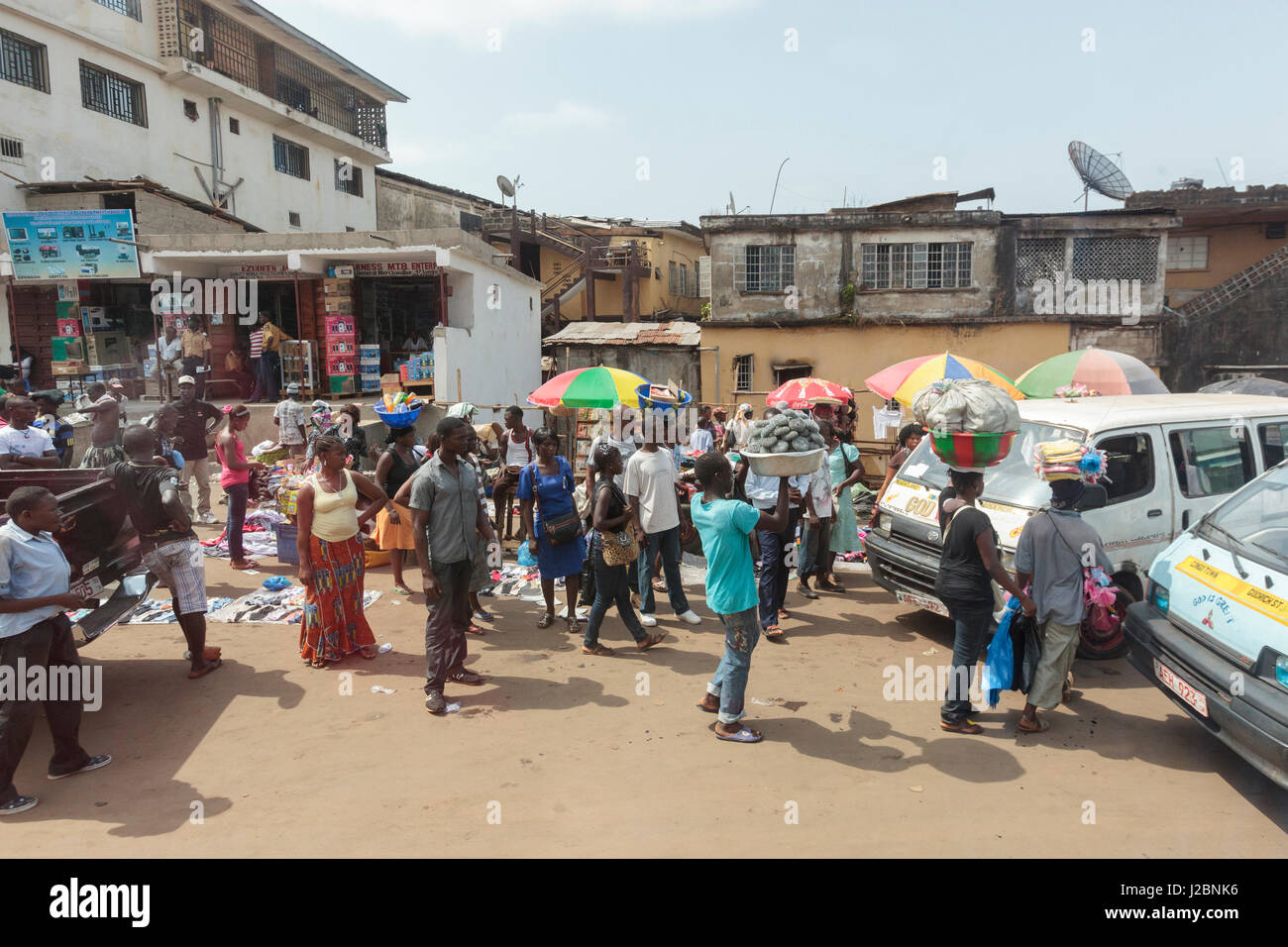 Africa, Sierra Leone, Freetown. People buying and selling goods at a market Stock Photo Alamy