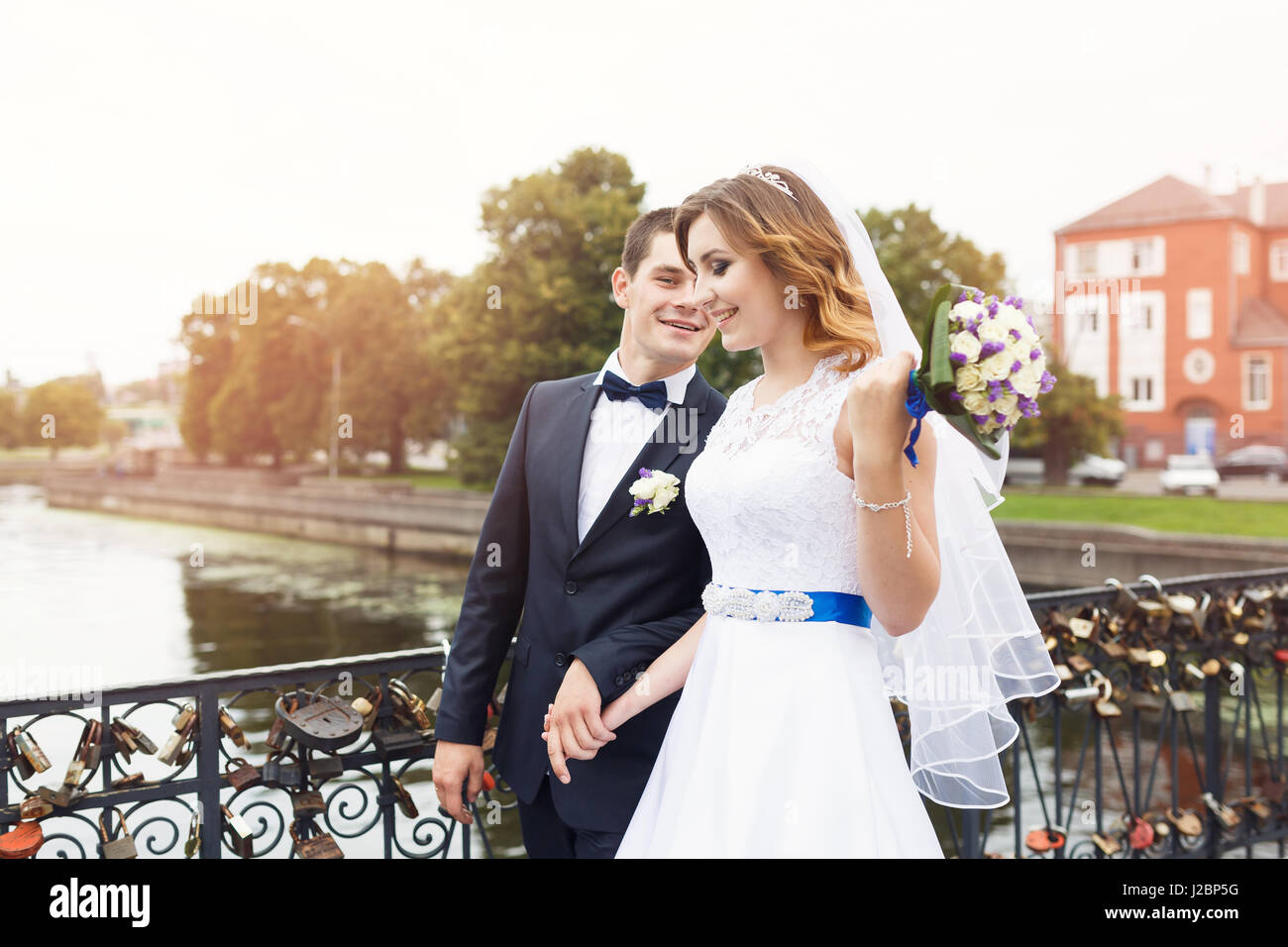 Young couple love lock bridge hi-res stock photography and images - Alamy